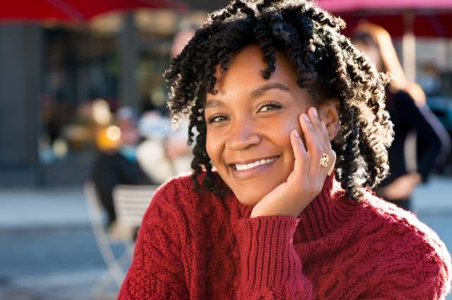 A smiling girl is shown. This represents concepts of depression treatment in St. Louis, MO. Our therapists in St. Louis, MO can help treat depression.